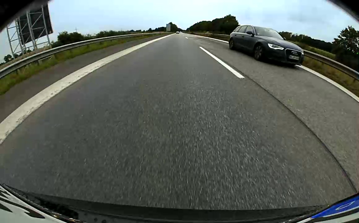 Audi A6 overtaking a Tesla Model S
